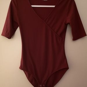 3/4 sleeve burgundy bodysuit.